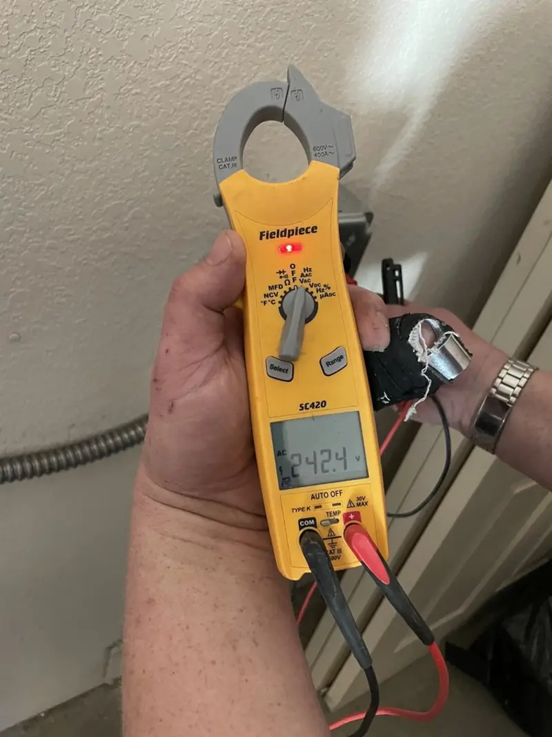 Voltage testing with clamp meter during Whole House Surge Protector in Lula